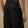 Pantalones holgados de denim 3/1