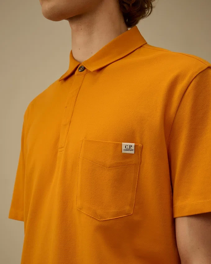 Polo de manga corta con bolsillo en el pecho de piqué elástico